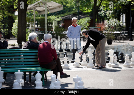 Men playing a giant chess game in a park in Geneva, Switzerland Stock Photo