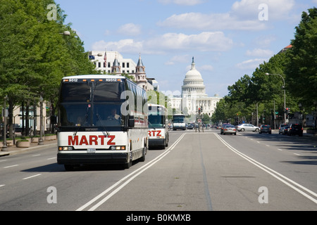 Buses on a Washington DC street with The United States Capitol building in the background USA Stock Photo