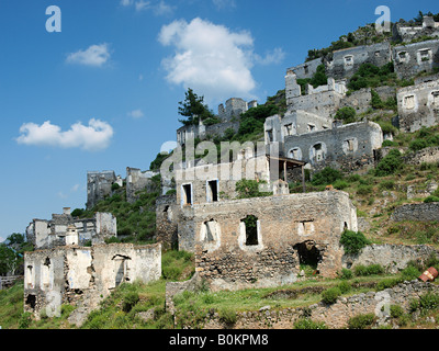DERELICT AND RUINED  ROOFLESS BUILDINGS AND HOMES AT  KAYAKOY MUGLA  TURKEY Stock Photo