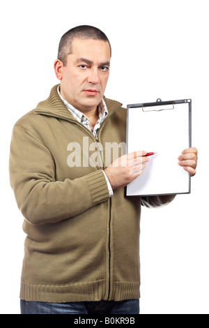 Serious casual man holding a blank clipboard over white background Stock Photo