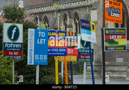 Estate agent for sale to let signs Stock Photo