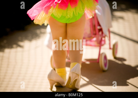 girl, play, dress-up, mother-roll, imagine, young, shoe, little foot in big shoe, moms shoes, baby stroller, toy, imagination, Stock Photo