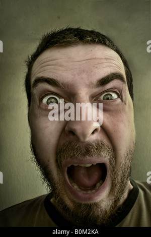Scream of scared amazed funny man Stock Photo