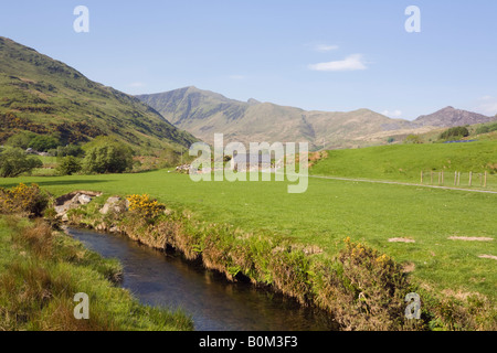 Afon Dwyfor river in rural Welsh valley with mountains in Cwm Pennant Snowdonia National Park Gwynedd North Wales UK Stock Photo