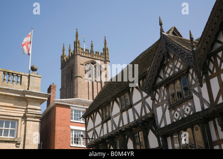 Ludlow Shropshire West Midlands England UK Black and white timber framed medieval building with church of St Laurence tower Stock Photo