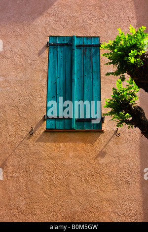 Colorful wood shutters on the quaint charming buildings in the seaport of Collioure France Stock Photo