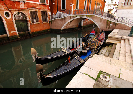 Gondolas on a canal in Venice Stock Photo