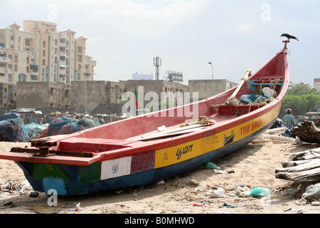 A colourful wooden fishing boat moored up on Marina Beach in Chennai, India Stock Photo