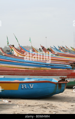 Colourful wooden fishing boats lined up on Marina Beach in Chennai, India Stock Photo