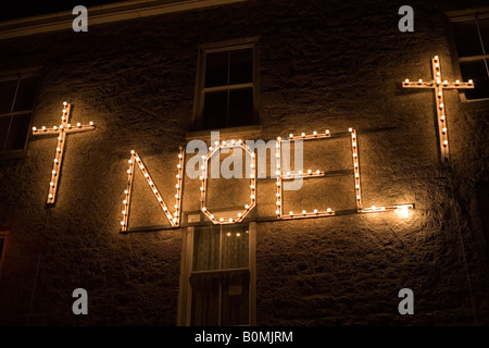 Christmas lights in the harbour at Mousehole, Cornwall Stock Photo