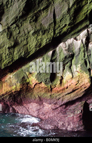 Rainbow effect inside of a cave on the main island of Heimaey on the Westman Islands, Iceland. Stock Photo