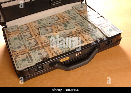 a briefcase full of American Dollars money Stock Photo