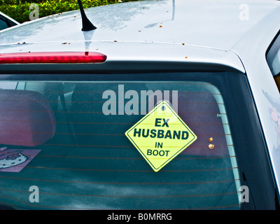 Humour on back window of private car in car park in UK Stock Photo