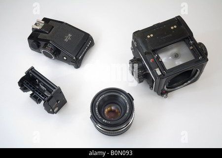 classic Mamiya 645 medium format camera broken down into its individual parts Stock Photo