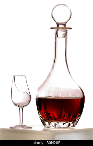 Decanter of sherry and broken glass Stock Photo