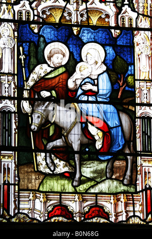 Stained Glass Window Depicting Mary and Joseph Flight into Egypt,  Church of St Fabian & St Sebastian, Woodbastwick, Norfolk Stock Photo