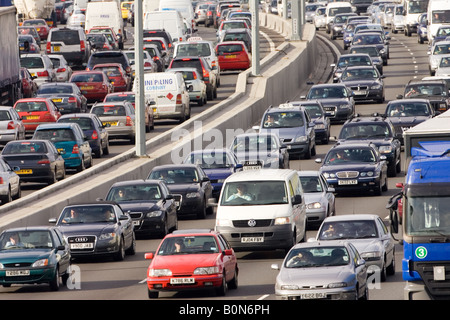 Traffic congestion of cars and vans in both directions on M25 motorway near London United Kingdom Stock Photo