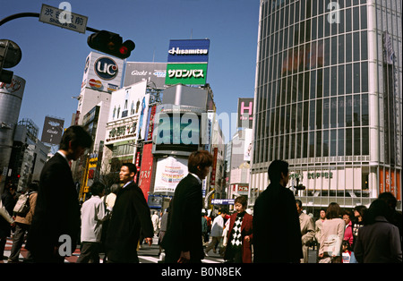 People cross what is reportedly the world's busiest scramble crossing in central Tokyo's Shibuya in Japan. Stock Photo