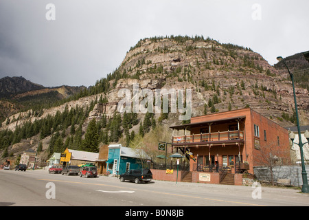 Shops line Main Street San Juan Skyway in Ouray Colorado small town nestled in the mountains nicknamed 'Switzerland of America' Stock Photo