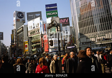 People cross what is reportedly the world's busiest scramble crossing in central Tokyo's Shibuya in Japan. Stock Photo