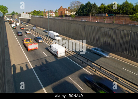 Horizontal elevated wide angle of the rush hour traffic driving along the busy A2 in London on a sunny day. Stock Photo