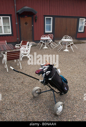 Golf bag on a cart outside a golf club house in Sweden Stock Photo