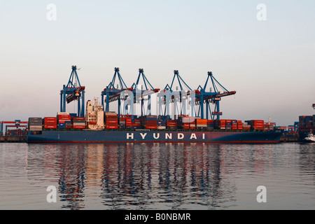 Ship being loaded with cargo in the harbour of Hamburg Germany, Container Terminal Altenwerder, CTA Stock Photo