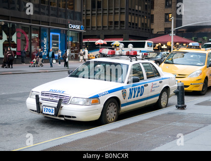 Nypd Police Patrol Car And Yellow Taxi Cabs Manhattan Midtown New York 