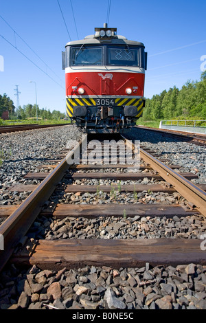 Electric locomotive and wooden sleepers on rails , Finland Stock Photo