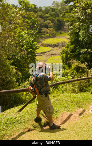 COSTA RICA Tourist taking picture of excavated site of pre Columbian city Guayabo National Monument near the town of Turrialba Stock Photo