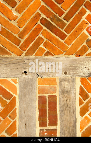 Close up of Elizabethan timber framed building with red bricks Stock Photo