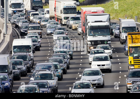 Traffic congestion cars and trucks on M25 motorway London United Kingdom Stock Photo