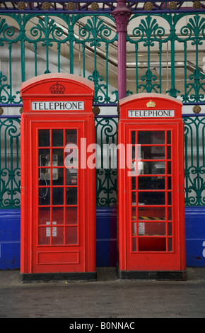 Two traditional red telephone Boxes in Smithfield Market London Stock Photo
