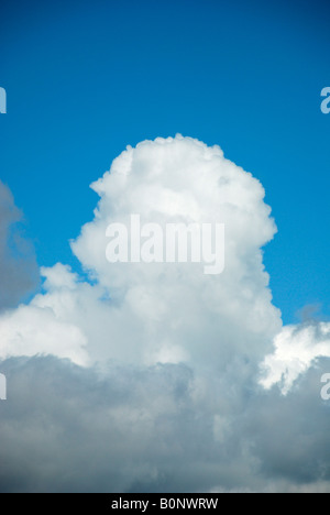 large cloud building against blue sky Stock Photo
