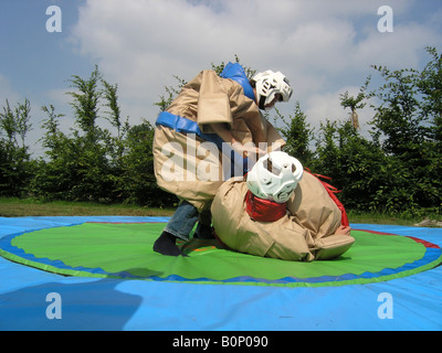 students sumo wrestling at school camp Stock Photo