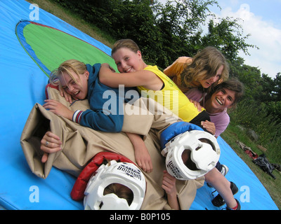 girl students sumo wrestling at school camp Stock Photo