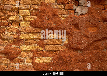Venetian Old brick wall with falling red mortar Stock Photo