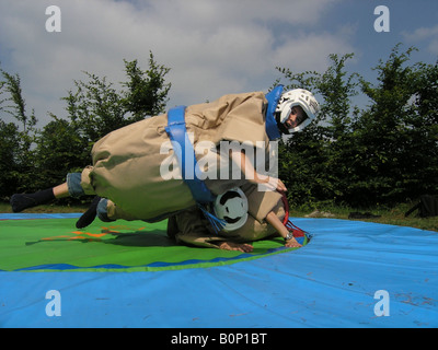 students sumo wrestling at school camp Stock Photo