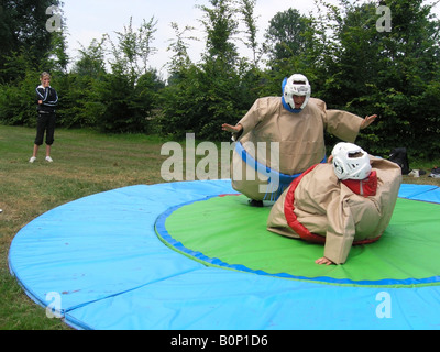 students sumo wrestling at school camp Stock Photo