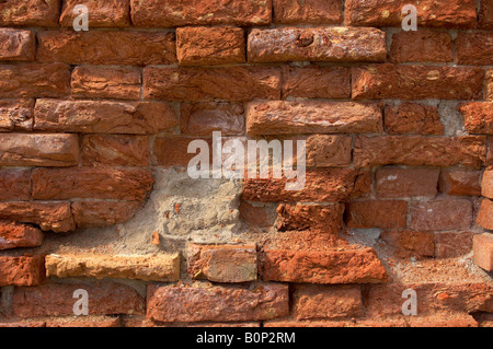 Venetian Old brick wall with falling red mortar Stock Photo