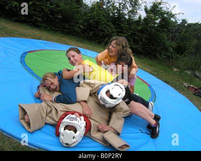 girl students sumo wrestling at school camp Stock Photo