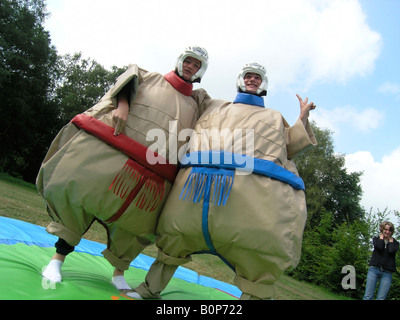 students in sumo wrestling suits at school camp Stock Photo