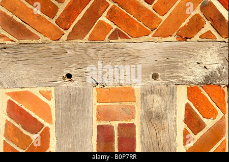 Close up of Elizabethan timber framed building with red bricks Stock Photo