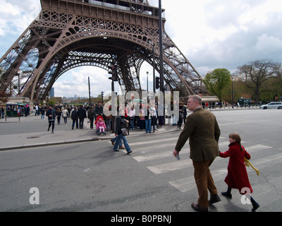 People tourists crossing the street near Eiffel Tower Paris France Stock Photo