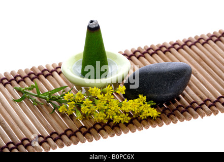 scent joss stick pebble and flower on mat for mental relaxation Stock Photo