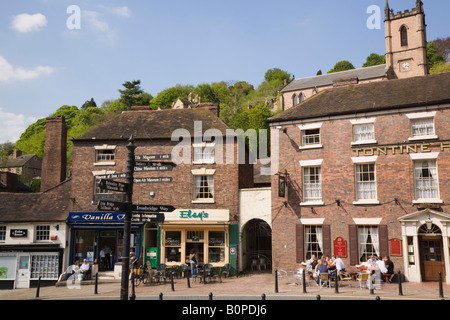 Ironbridge Shropshire England UK Hotel cafes and shops with tourist sitting at tables outside on Tontine Hill in town centre Stock Photo