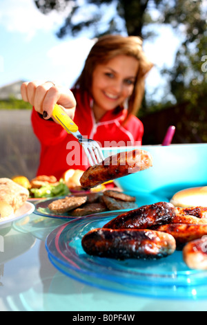 Young Woman Choosing Sausage Model Released Stock Photo