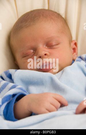 Close Up on Face of Sleeping Newborn Baby Boy Joshua Kailas Hudson Aged 20 days Blowing Bubbles Stock Photo