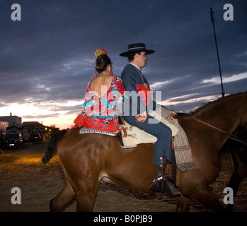 couple on horseback in El Rocío Stock Photo