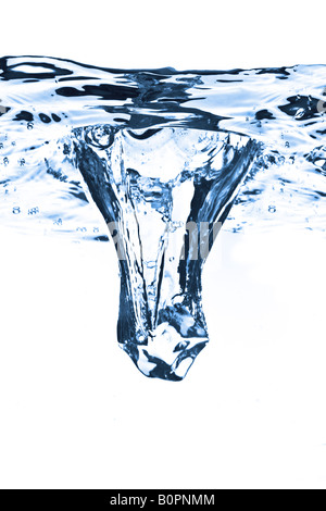 ice cube dropped into water with splash isolated on white Stock Photo ...